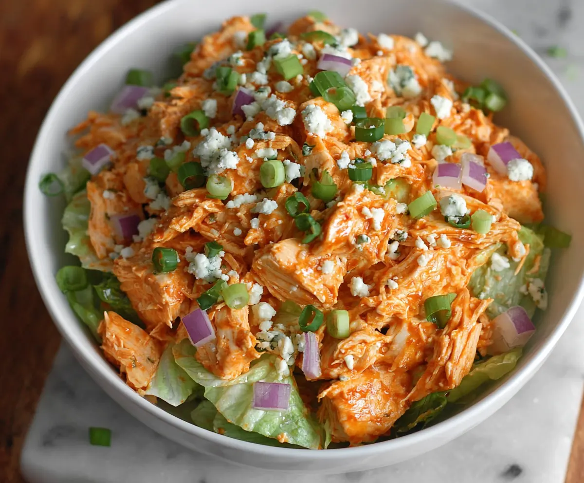 Creamy Buffalo Chicken Salad with Celery and Blue Cheese in a bowl, perfect for a flavorful lunch or dinner.