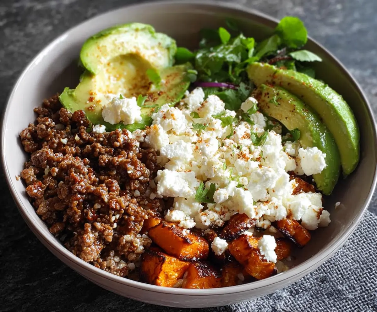 Delicious Ground Beef Power Bowl topped with fresh avocado slices and cottage cheese, healthy and satisfying meal.