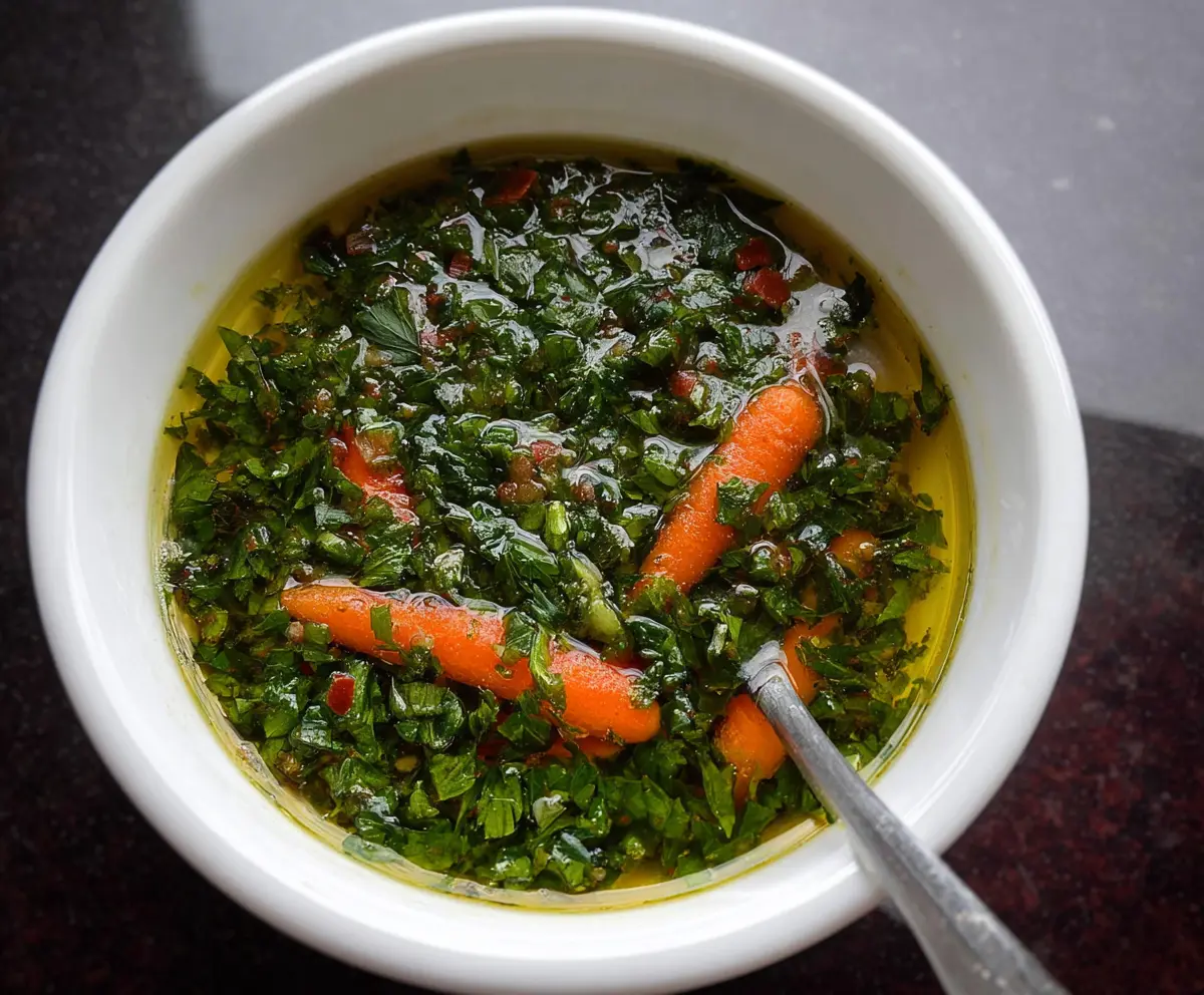 Fresh Carrot Top Chimichurri sauce with vibrant green herbs and finely chopped vegetables.