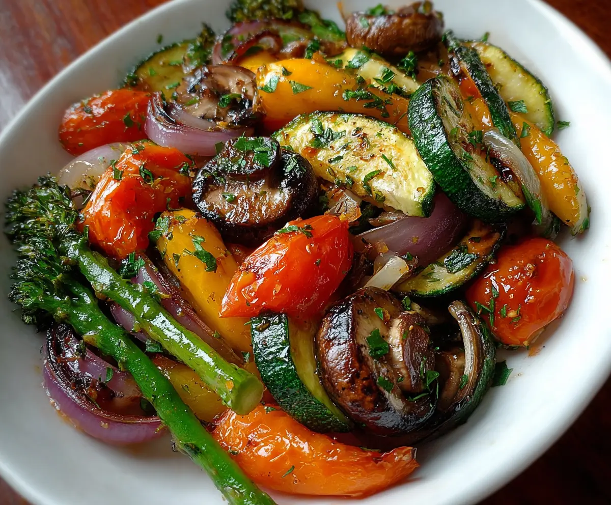 Colorful healthy sautéed vegetables with bell peppers, zucchini, and carrots in a skillet.